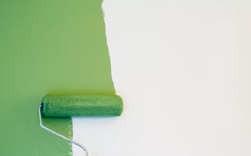 Different types of paint cans with a drying time chart in the background