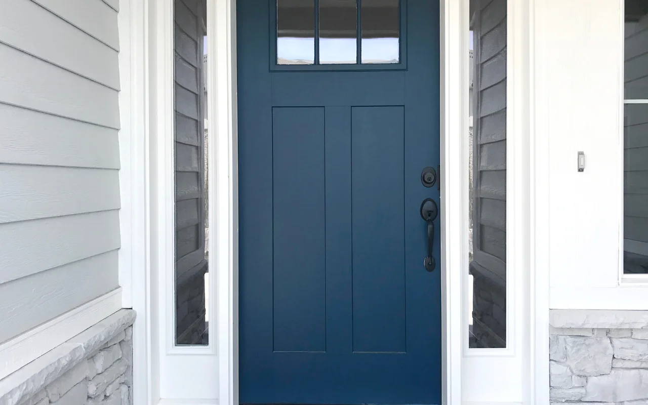 Painting over a white interior door with a roller and fresh color