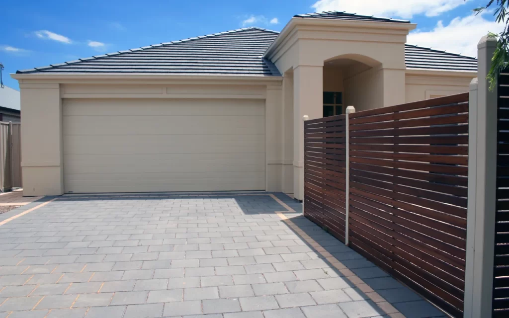 Before and after comparison of a garage door repainting project